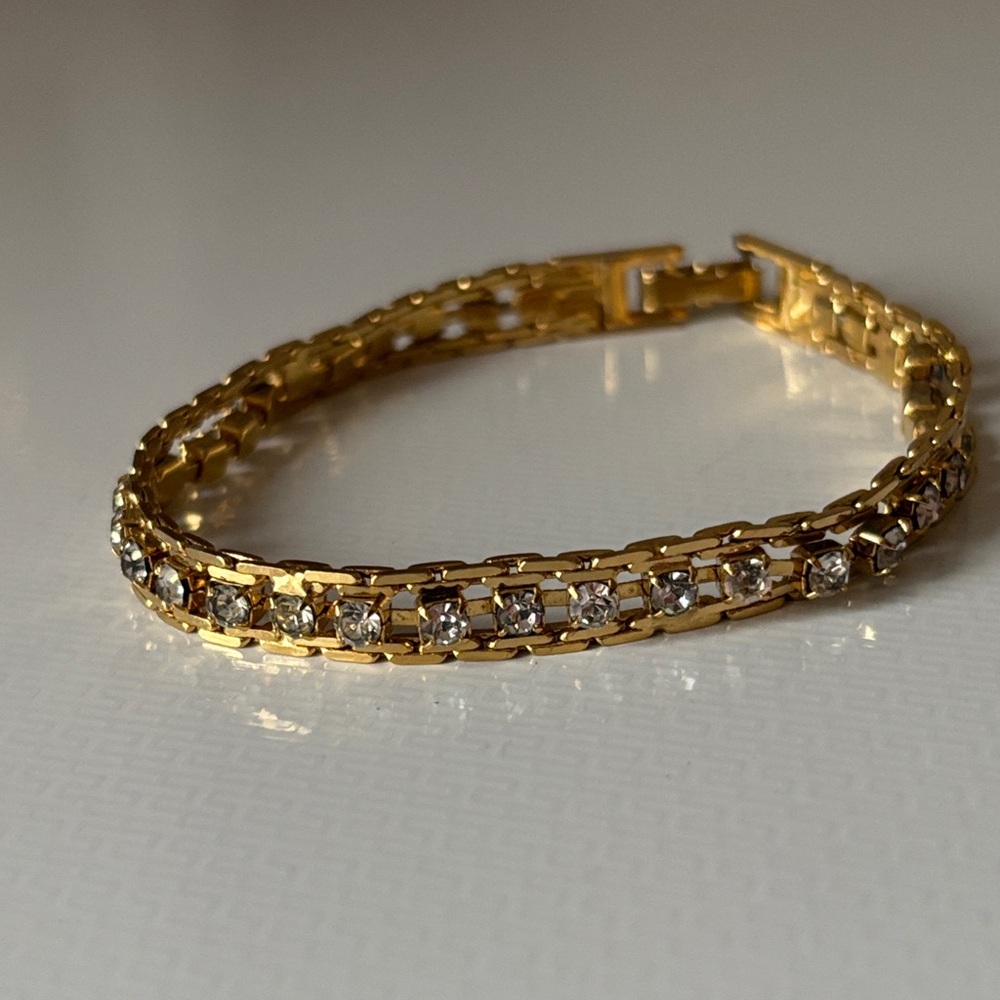 Gold tone and rhinestone tennis bracelet
